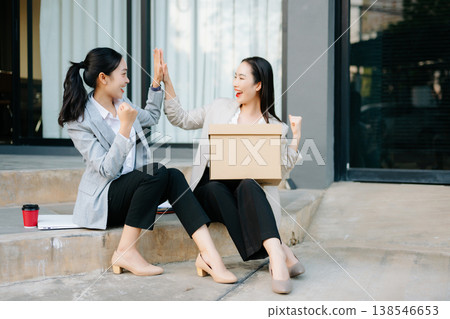 Happy businesswomen celebrating success and new job opportunity after career change, teamwork support, motivation, confidence Happy businesswomen celebrating success and new job opportunity after career change, teamwork support, motivation, confidence 138546653