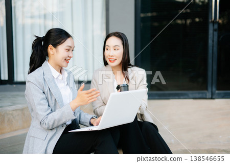Asian businesswomen discussing career planning and new job opportunity with laptop, teamwork collaboration, professional consulting Asian businesswomen discussing career planning and new job opportunity with laptop, teamwork collaboration, professional consulting 138546655