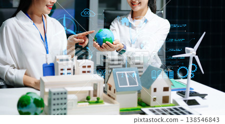 Business professionals presenting sustainable city model with solar panels and wind turbine, renewable energy, ESG strategy, green business 138546843
