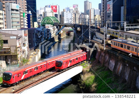 View of Tokyo Metro and JR trains crossing from Hijiribashi Bridge 138548221