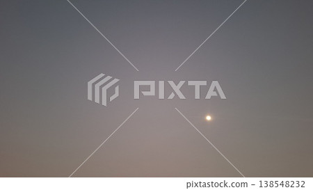 Full Moon Shining Through Hazy Dusk Sky with Minimalist Soft Gradient Background 138548232