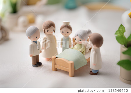 A miniature depiction of everyday caregiving scenes showing gentle support. 138549450