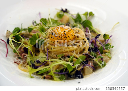 Creamy Spaghetti Carbonara with Raw Egg Yolk and Fresh Herbs Creamy Spaghetti Carbonara with Raw Egg Yolk and Fresh Herbs 138549557