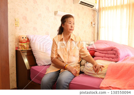 Senior Woman in Pink Bedroom Senior Woman in Pink Bedroom 138550094