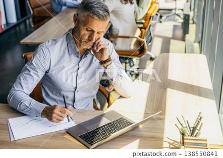 Professional legal advisor examining contract details carefully Professional legal advisor examining contract details carefully 138550841