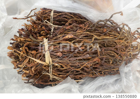 Wild tea sheng puer, dried and tangled, rests in plastic Wild tea sheng puer, dried and tangled, rests in plastic 138550880