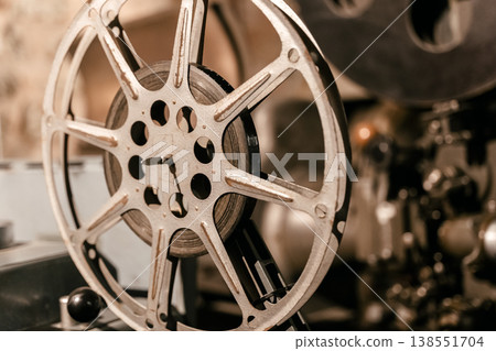 Vintage Film Reel Close Up on Old Projector Showing Classic Cinema Technology Detail 138551704