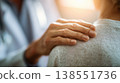 Doctor's hand gently resting on patient's shoulder as a reassuring gesture. 138551736