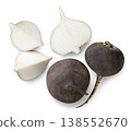Black radish, half and pieces on a white background. Top view 138552670