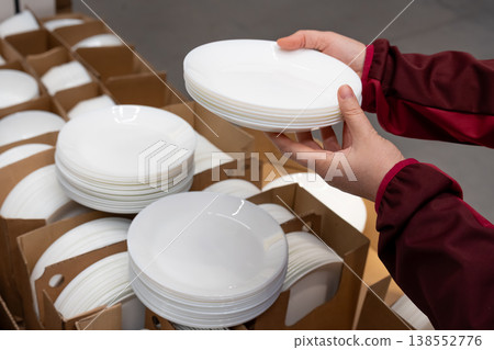 Boxes of white plates in crockery shop, dishware, tableware stack in store 138552776