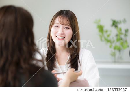 The image of a female nail technician providing attentive customer service, beauty services, and consultations at a nail salon. The image of a female nail technician providing attentive customer service, beauty services, and consultations at a nail salon. 138553037