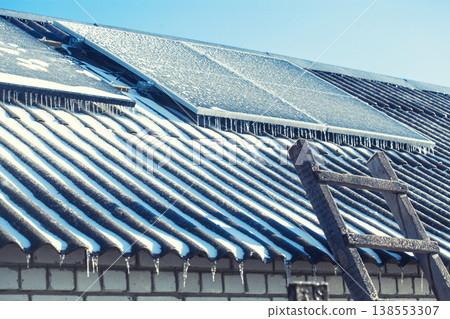 Solar Panels covered with ice and frost on a cold and sunny winter day Solar Panels covered with ice and frost on a cold and sunny winter day 138553307
