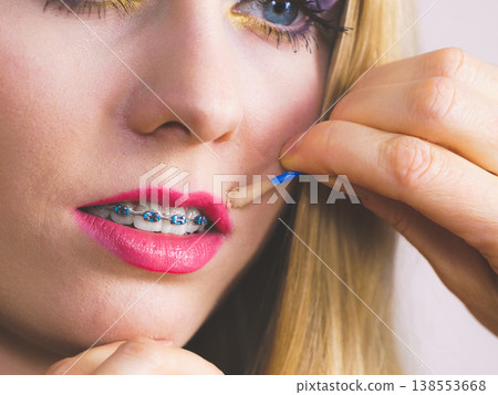Woman getting make up done by artist Woman getting make up done by artist 138553668