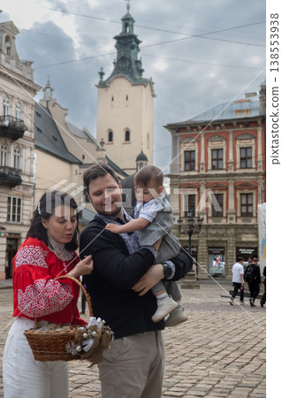 Family with toddler in historic old town square 138553938
