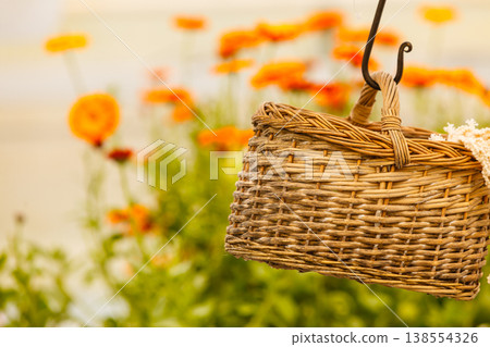 Wicker baskets hanging under ceiling Wicker baskets hanging under ceiling 138554326