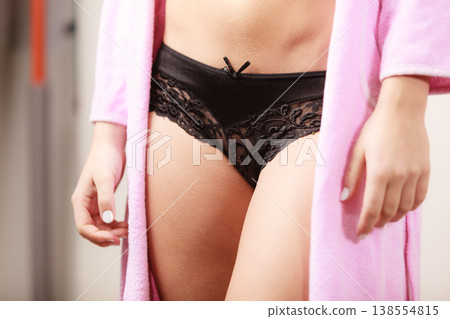 Woman wearing black lingerie and bathrobe 138554815