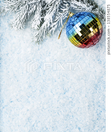 Vertical Christmas disco ball ornament with snowy pine 138554875