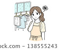 A woman struggling with laundry on rainy days 138555243
