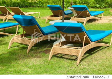 Chairs ready for people to relax in Bali near a pool Chairs ready for people to relax in Bali near a pool 138555295