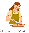 Smiling woman in apron slices a tomato on a board. A cozy home cooking scene featuring healthy food 138555438
