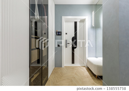 Luxury Entryway Interior with Glass Wardrobe and Designer Door 138555738
