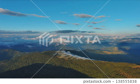 Aerial view of amazing rocky mountains at sunset Aerial view of amazing rocky mountains at sunset 138555838