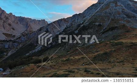 Aerial view of amazing rocky mountains at sunset Aerial view of amazing rocky mountains at sunset 138555851