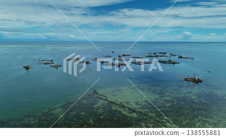 Fish farm with cages for fish and shrimp Fish farm with cages for fish and shrimp 138555881