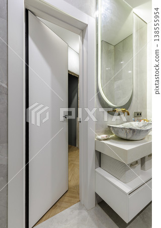 Modern Bathroom with Stone Vessel Sink and Gold Faucet 138555954