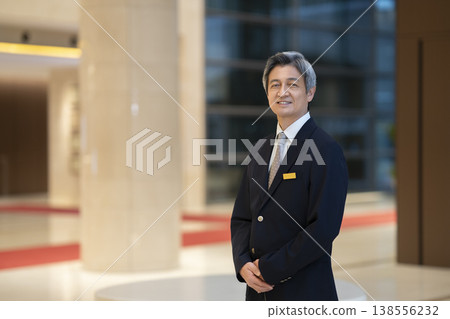 Portrait of a senior businessman smiling and looking directly at the camera. 138556232
