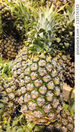 Ripe juicy pineapples at the market Ripe juicy pineapples at the market 138556383