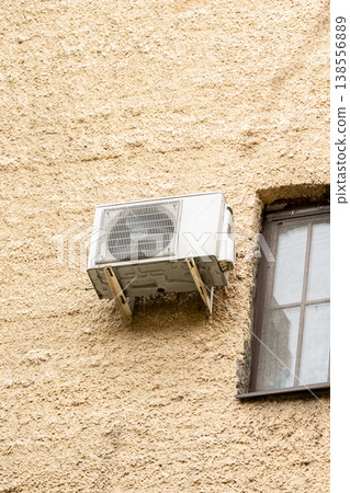 air conditioning on facade of building, air cooling in hot weather. air conditioning on facade of building, air cooling in hot weather. 138556889