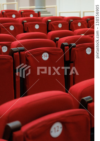 auditorium of cinema or theater. Empty rows of red velvet armchairs filling auditorium. auditorium of cinema or theater. Empty rows of red velvet armchairs filling auditorium. 138556905