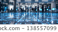 Photo of a modern office lobby with a digital network overlay on the floor, depicting connectivity and technology in a business environment. 138557099