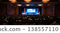 Photo of a large crowd of people attending a conference in a convention center 138557110