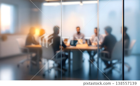 Photo of blurred business meeting in modern office behind glass wall, teamwork and collaboration concept Photo of blurred business meeting in modern office behind glass wall, teamwork and collaboration concept 138557139