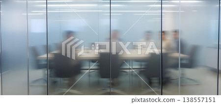 Photo of a blurred meeting room behind frosted glass, business meeting in progress, office interior, corporate environment, teamwork and collaboration concept Photo of a blurred meeting room behind frosted glass, business meeting in progress, office interior, corporate environment, teamwork and collaboration concept 138557151