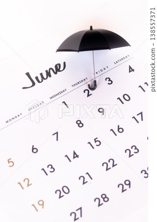 Calendar and umbrella Calendar and umbrella 138557371