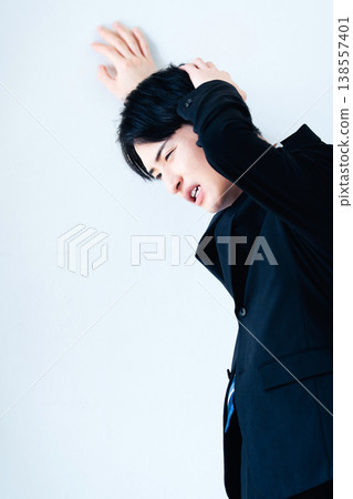 A depressed young businessman A depressed young businessman 138557401