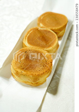 Large, white-background imagawayaki (or kaitenyaki) - a traditional Japanese confectionary. 138558479