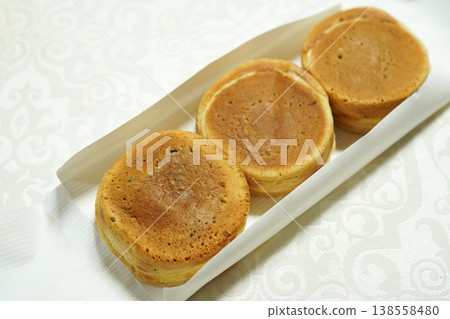 Obanyaki (also known as Imagawayaki or Kaitenyaki), a traditional Japanese confection. Obanyaki (also known as Imagawayaki or Kaitenyaki), a traditional Japanese confection. 138558480