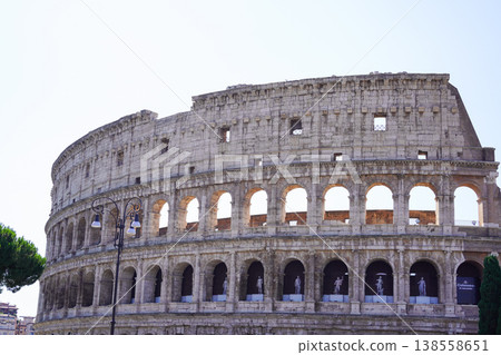 A tourist attraction in Rome, Italy: the exterior of the Colosseum and the blue sky. A tourist attraction in Rome, Italy: the exterior of the Colosseum and the blue sky. 138558651