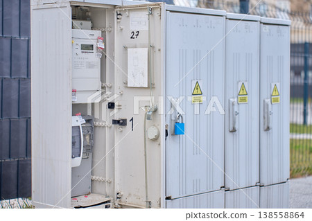 Open outdoor electricity meter cabinet with utility equipment Open outdoor electricity meter cabinet with utility equipment 138558864