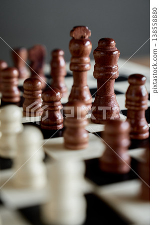 Wooden chess pieces on chessboard for strategy game 138558880