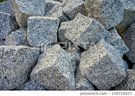 Pile of rough granite stones. Material for construction Pile of rough granite stones. Material for construction 138558925