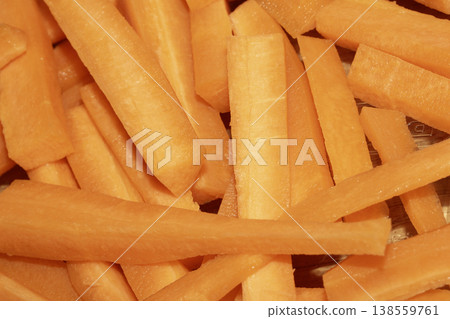 Close up of cubed chopped and peeled sliced carrots abstract background Close up of cubed chopped and peeled sliced carrots abstract background 138559761