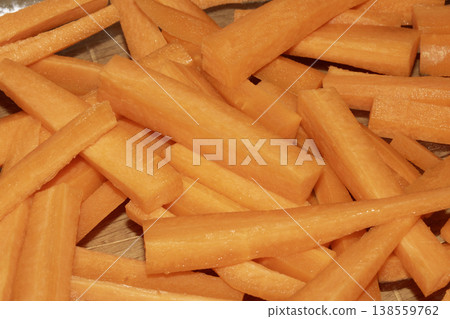 Close up of cubed chopped and peeled sliced carrots abstract background Close up of cubed chopped and peeled sliced carrots abstract background 138559762