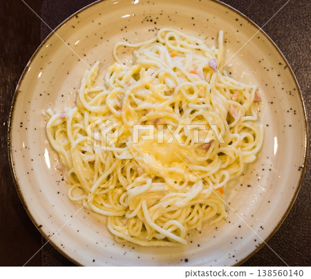 traditional italian pasta carbonara on a plate. top view traditional italian pasta carbonara on a plate. top view 138560140