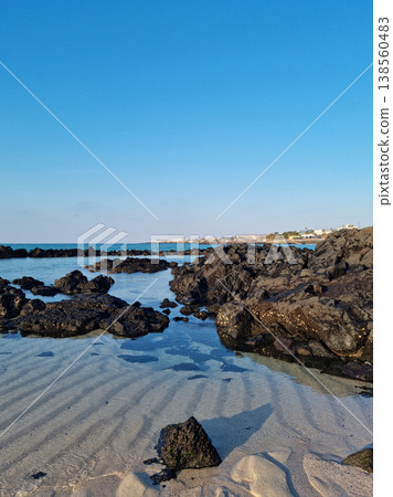 This is a Jeju seascape with basalt rocks. 138560483
