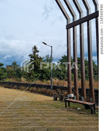 This is an outdoor park with benches. 138560490